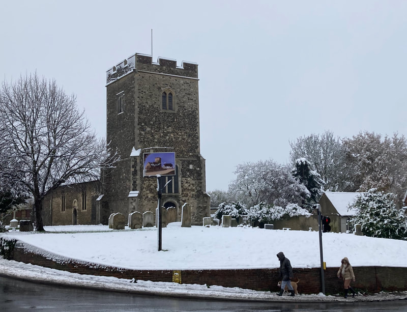 A day time view of a snowy St Mary's Church