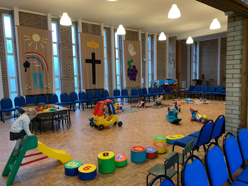 Emmanuel church, with chairs moved aside and set up with toys for toddler group.